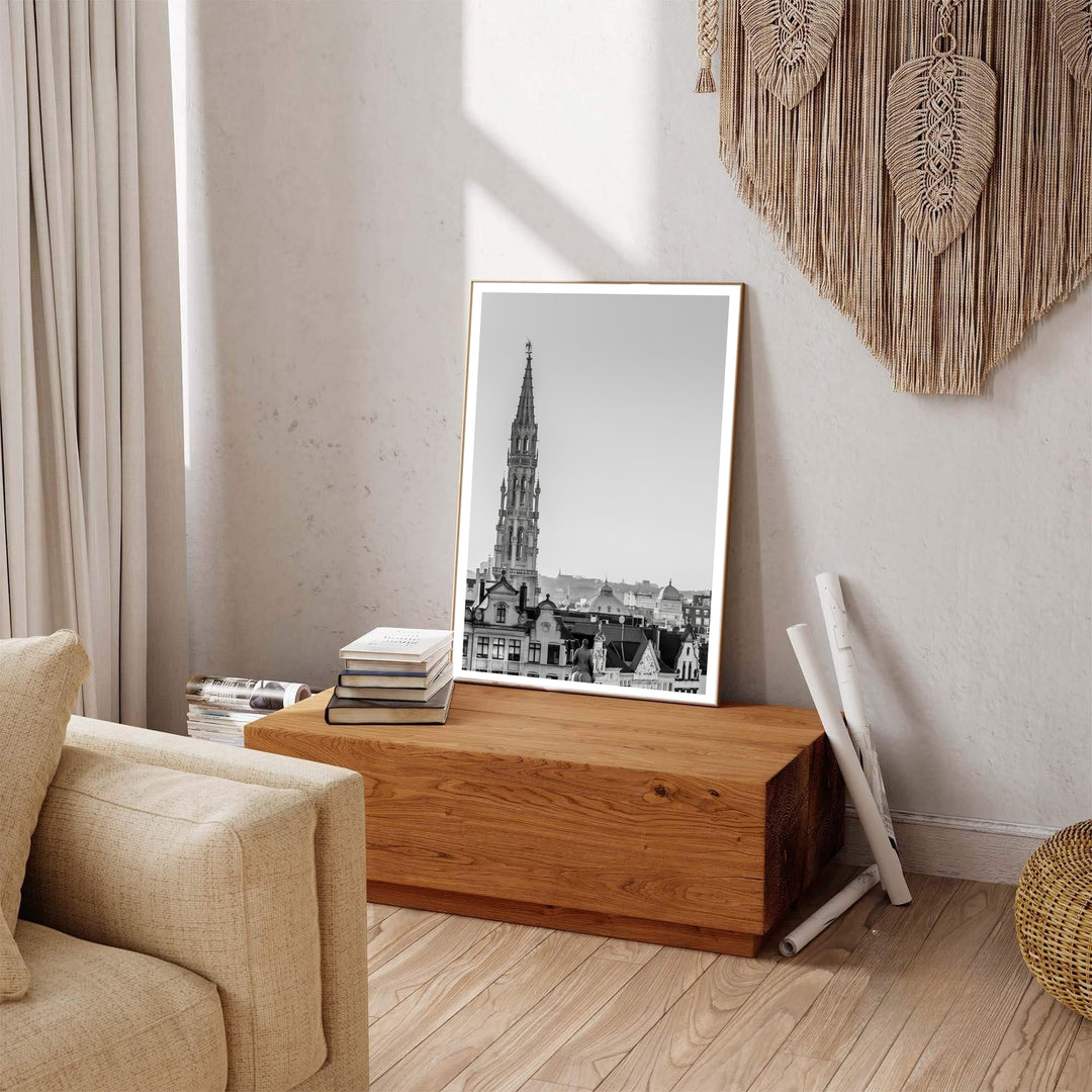 Captivating cityscape art print featuring the iconic spire rising above historic step-gabled buildings in Brussels, Belgium. Available across multiple options including unframed art paper, custom framed poster styles, and gallery canvas wall displays.