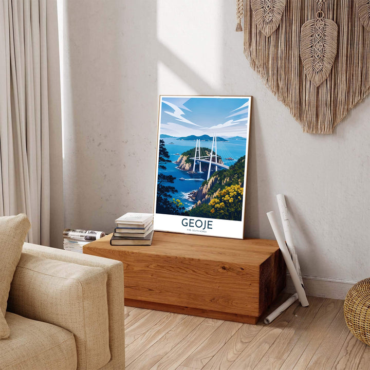 Colorful Asian travel poster of Geoje, South Korea, displaying an elevated viewpoint over coastal cliffs and blue island bays toward the white towers of Geoga Bridge. Offered by MapYourDreams, this artwork is available in flexible options including unframed paper, custom wooden frames, and gallery canvas wraps.