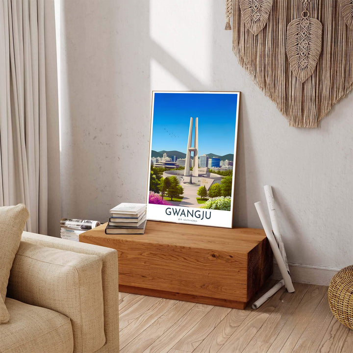 Colorful South Korean travel print displaying a symmetrical view of the May 18 Memorial Tower in Gwangju, flanked by lush green trees, pink azaleas, and modern buildings. Offered by MapYourDreams, this artwork is available in flexible options including unframed paper, custom wooden frames, and gallery canvas wraps.