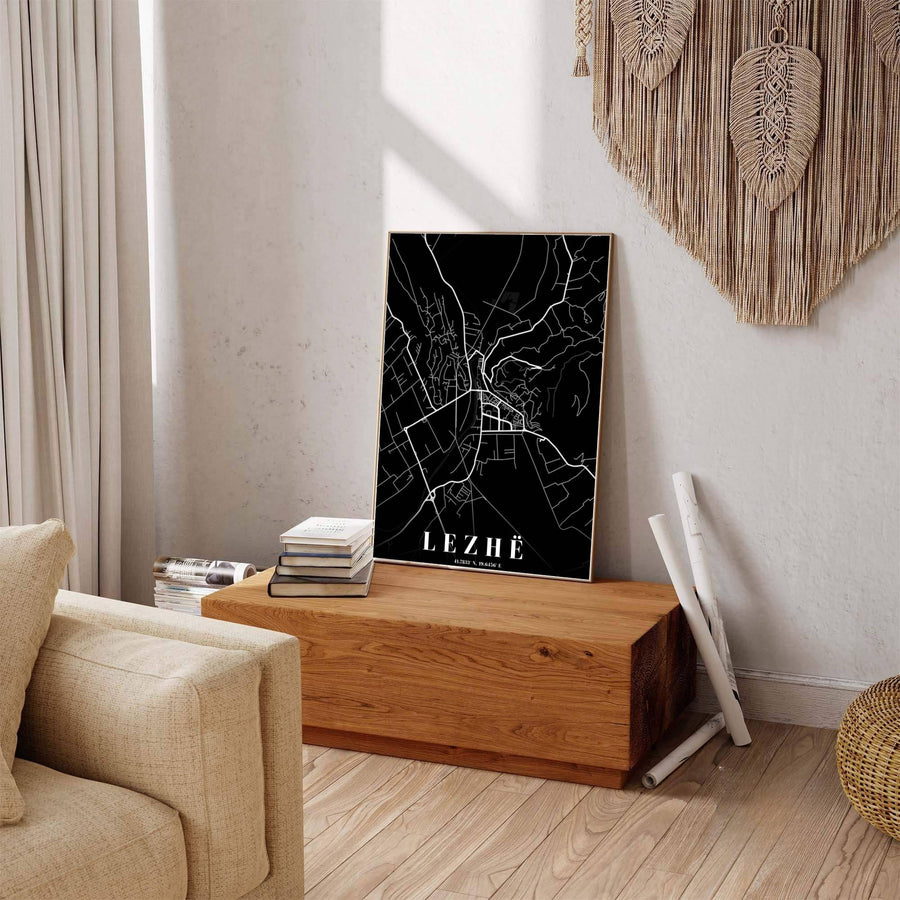 Pure white linework contrasts sharply against a deep black field in this elegant Lezhë map poster featuring geographic coordinates. Offered by MapYourDreams in custom choices such as unframed paper, wood-framed options, and gallery-style canvas.