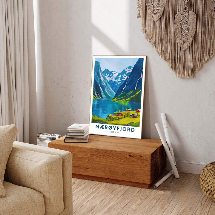 Crisp graphic travel poster of Nærøyfjord Norway featuring azure waters, sunlit mountain slopes, and red shoreline cabins. Carefully produced for lasting quality, this wall art selection includes versatile options like unframed art paper, solid wood framed prints, and textured canvas stretchers.