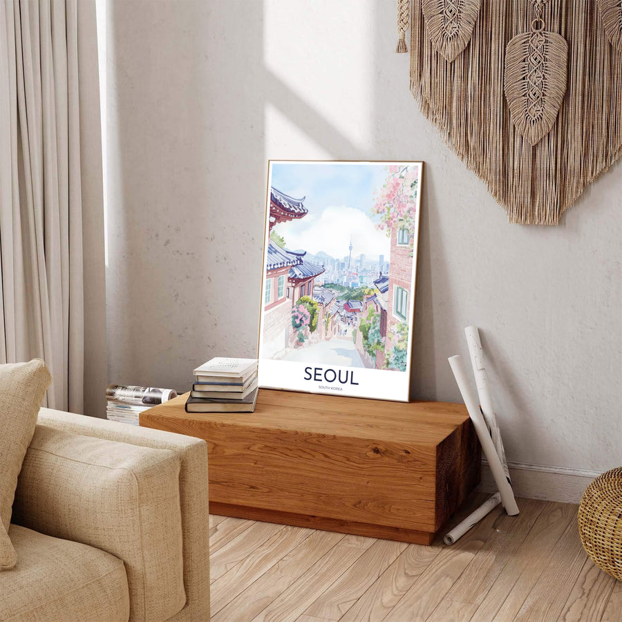 Colorful pastel watercolor travel poster of Seoul, South Korea, displaying an elevated viewpoint over traditional tiled roofs, soft pink floral blooms, and distant high-rise city towers. Offered by MapYourDreams, this artwork is available in flexible options including unframed paper, custom wooden frames, and gallery canvas wraps.