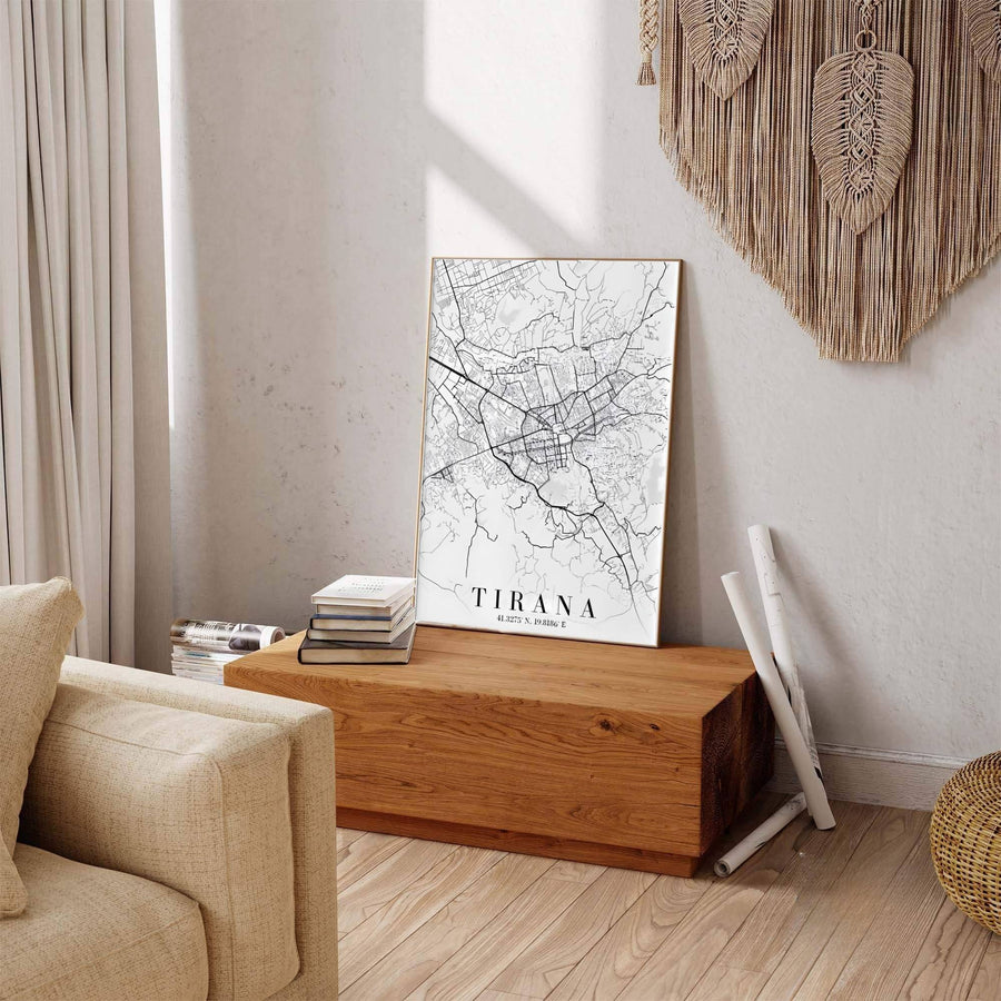 Pure black linework contrasts sharply against a clean off-white field in this elegant Tirana map poster featuring vertical portrait framing. Offered by MapYourDreams in custom choices such as unframed paper, wood-framed options, and gallery-style canvas.