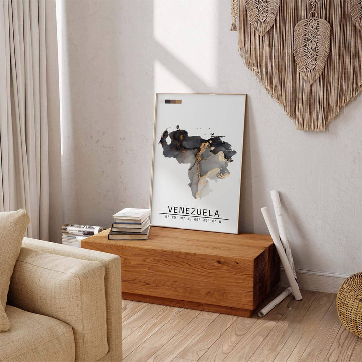 Beautiful South American landmark wall decor displaying the charcoal ink and metallic gold fluid silhouette of Venezuela. Available through MapYourDreams, this print accommodates various display preferences, including unframed art paper, framed prints, or canvas wraps.
