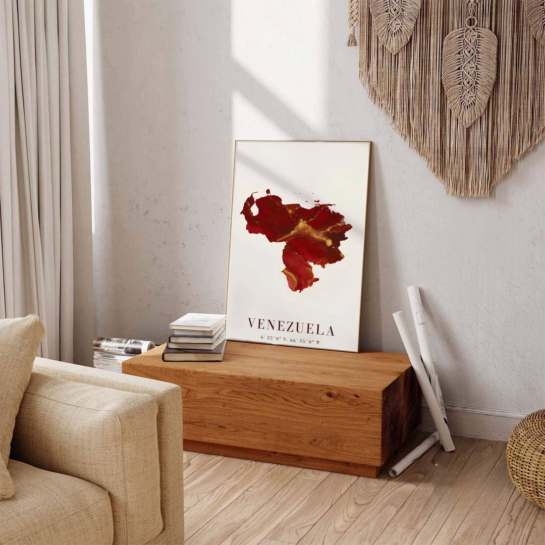 Beautiful South American landmark wall decor displaying the crimson red ink and metallic gold fluid silhouette of Venezuela. Available through MapYourDreams, this print accommodates various display preferences, including unframed art paper, framed prints, or canvas wraps.