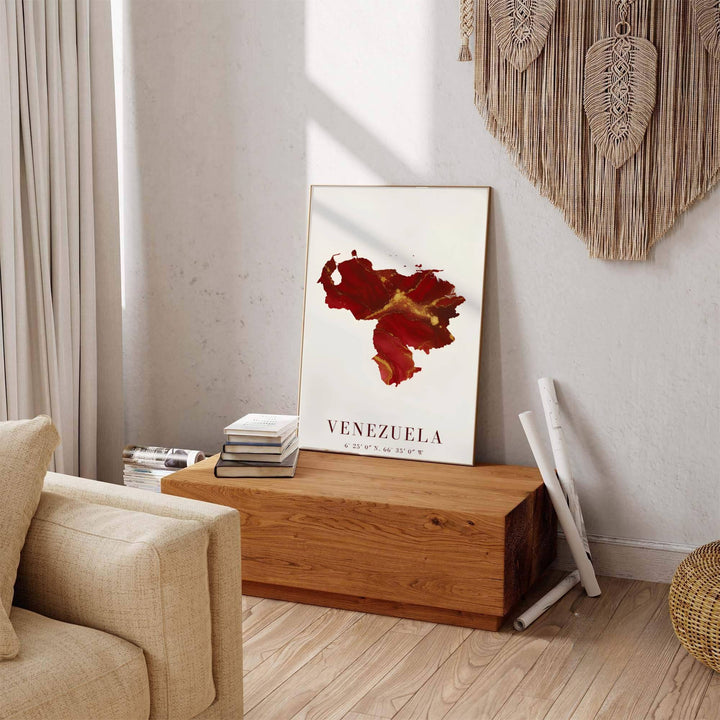 Beautiful South American landmark wall decor displaying the crimson red ink and metallic gold fluid silhouette of Venezuela. Available through MapYourDreams, this print accommodates various display preferences, including unframed art paper, framed prints, or canvas wraps.