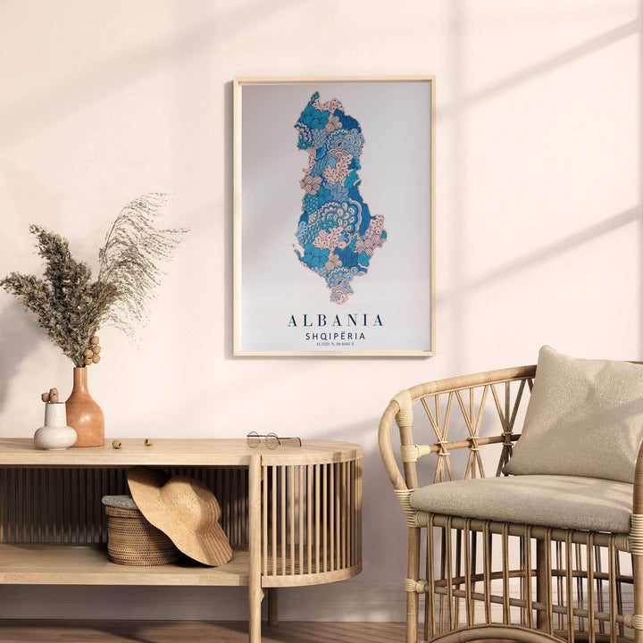 Minimalist Albania country map poster rendered in teal blue and blush floral linework with clear geographic coordinates printed underneath. Offered by MapYourDreams, this artwork is available in flexible options including unframed paper, custom wooden frames, and gallery canvas wraps.