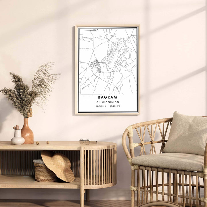 Minimalist vector art print of Bagram Afghanistan displaying city street maps and geographic coordinates in black and white, available from MapYourDreams as an unframed art print, stretched canvas wall art, or custom framed poster in natural wood moulding for home decor.