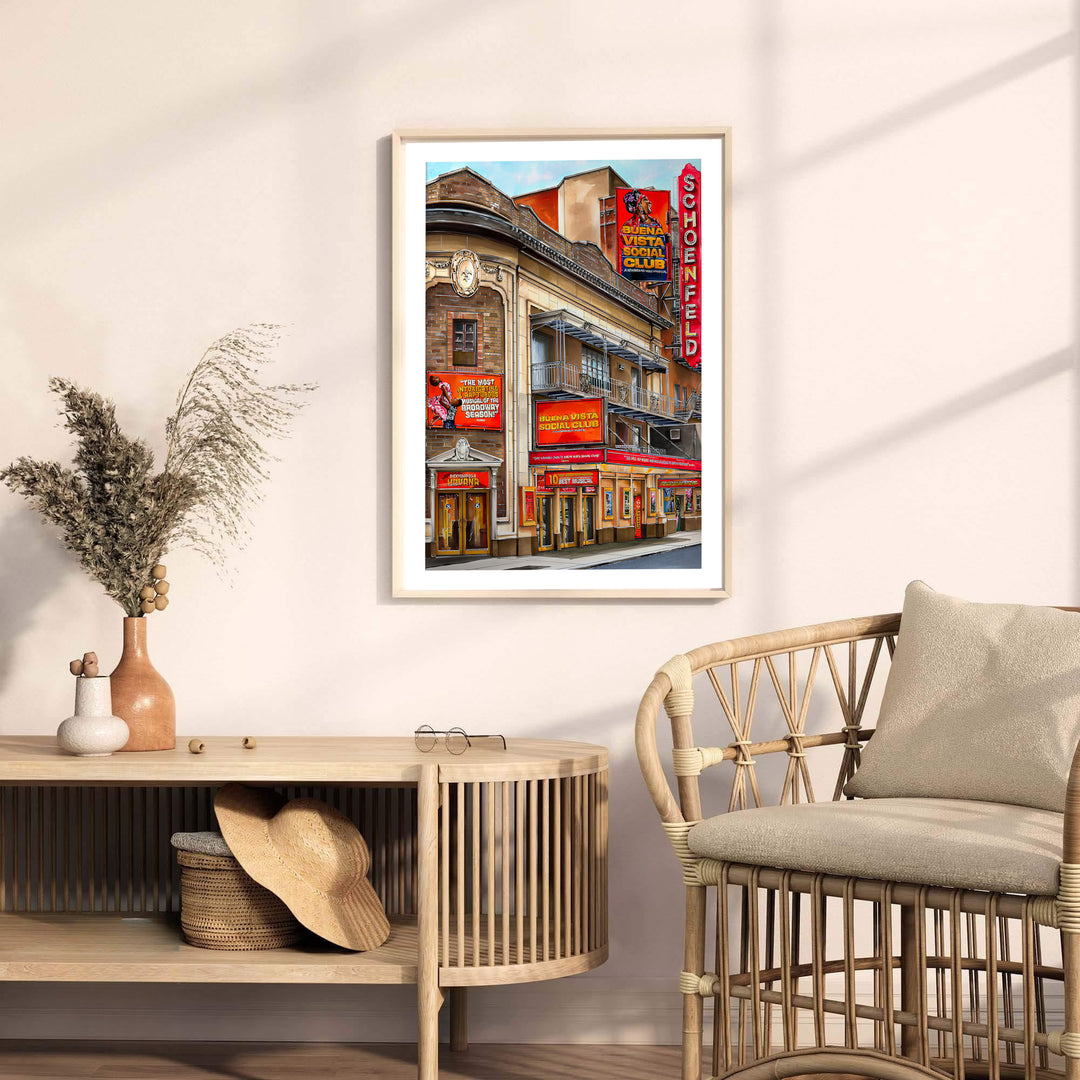 Fine art NYC theatre print detailing the Beaux-Arts stone arches, red lightbox signs, and ticket windows at the Gerald Schoenfeld Theatre, available from MapYourDreams with choices including unframed paper prints, stretched gallery canvas, or a tailored custom framed wall display for study rooms.