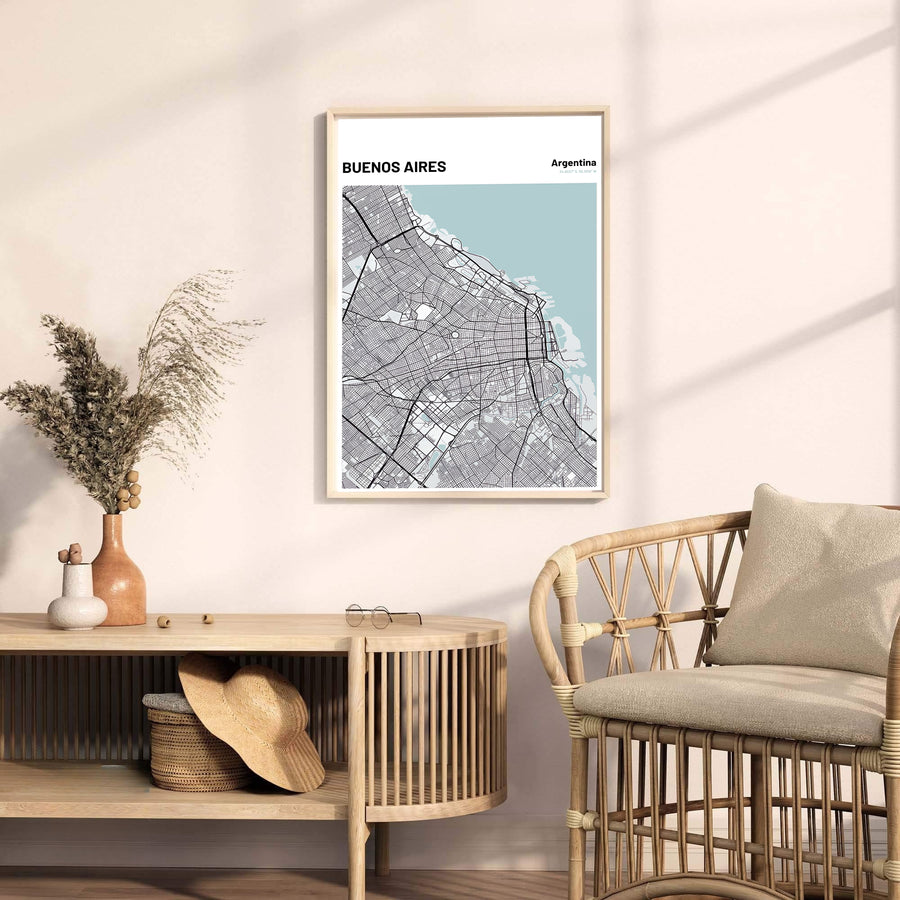 Minimalist cartographic wall decor showcasing the road network map of Buenos Aires with soft blue water background details. Available through MapYourDreams, this print accommodates various display preferences, including unframed art paper, framed prints, or canvas wraps.