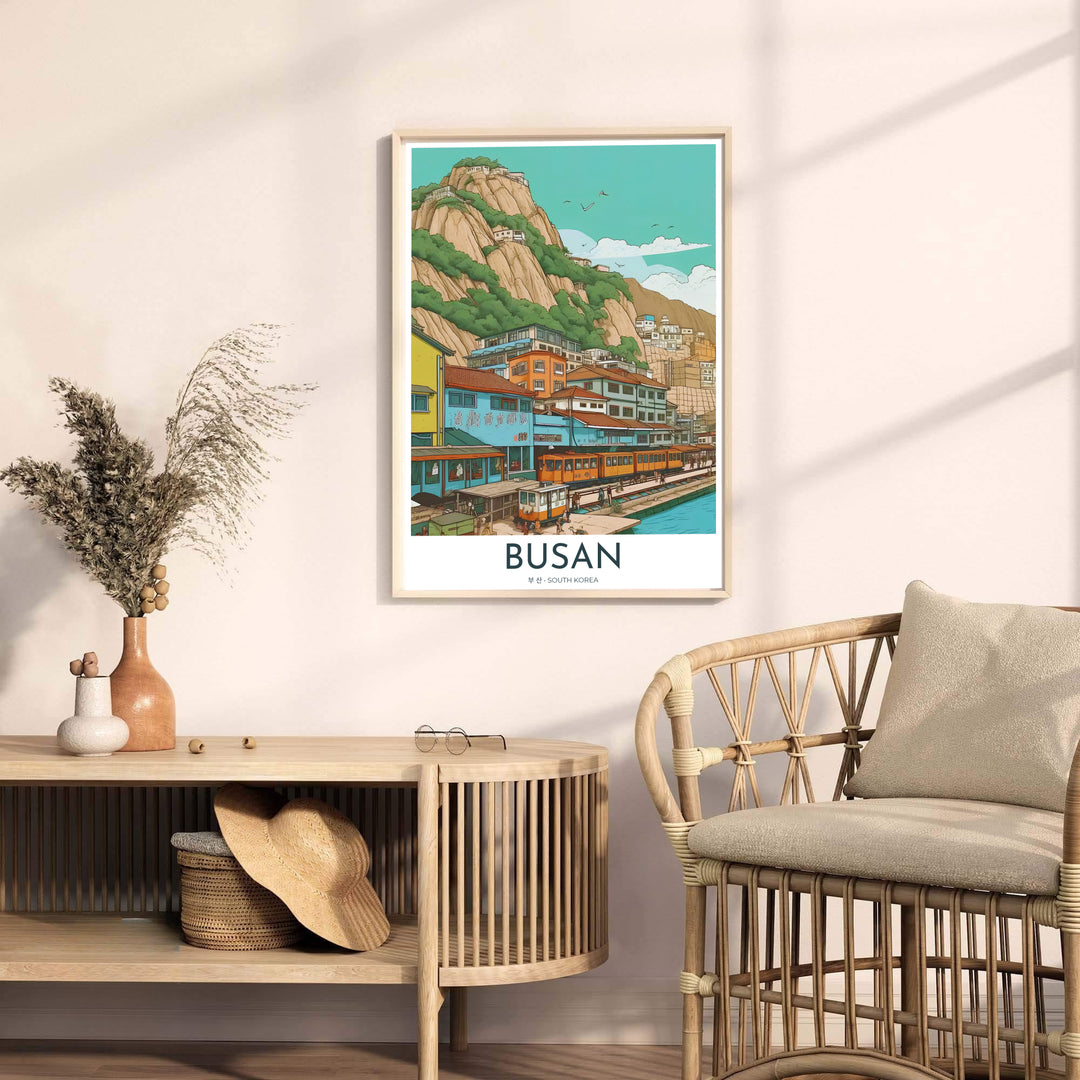 Artistic home decor print capturing the coastal allure of Busan, South Korea, featuring yellow train cars along the water&