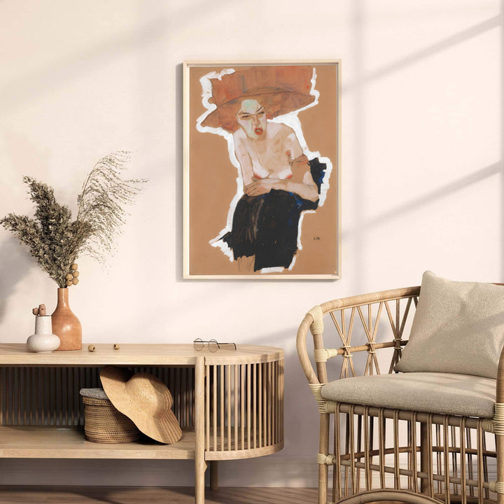 Rich red hat figure study poster print of Egon Schiele Seated Woman With Hat 1910 from Vienna Austria displaying dynamic seated pose. MapYourDreams provides premium framed prints, unframed paper wall poster decor, and stretched canvas choices for sophisticated art gallery walls.