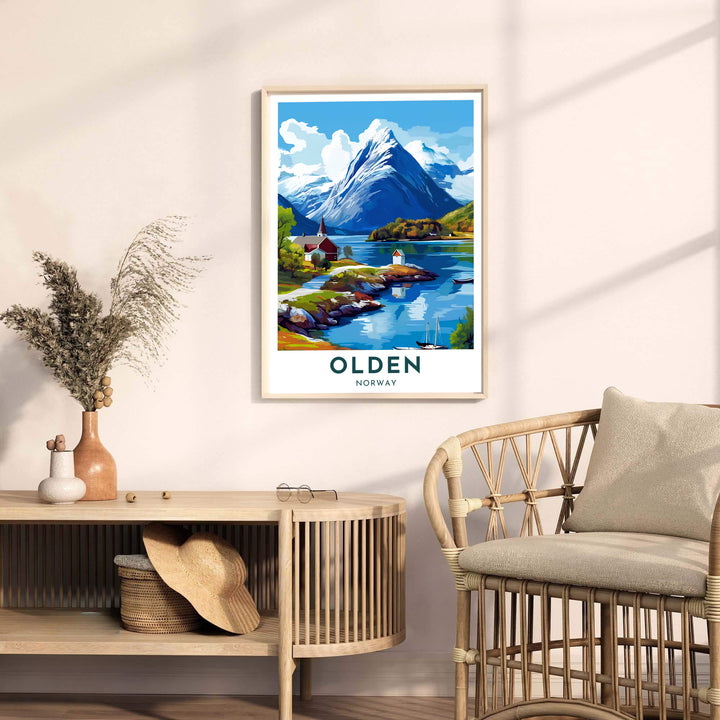 Scenic fjord landscape print depicting Olden Norway with traditional waterfront houses beneath dramatic alpine peaks and clear skies. Bring Scandinavian atmosphere home with display options including classic unframed paper, gallery wrapped canvas panels, or fully assembled framed wall art.