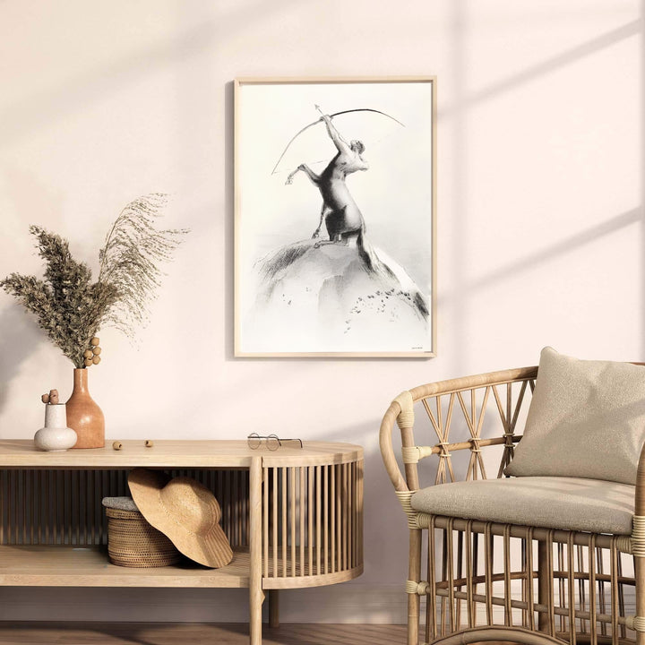 Monochrome Symbolist poster of the centaur archer on a cliff face, designed by French artist Odilon Redon in Centaur Aiming At The Clouds 1895. Suitable for modern gallery walls, your order can be completed as an unframed paper print, a custom framed piece, or a stretched canvas display.