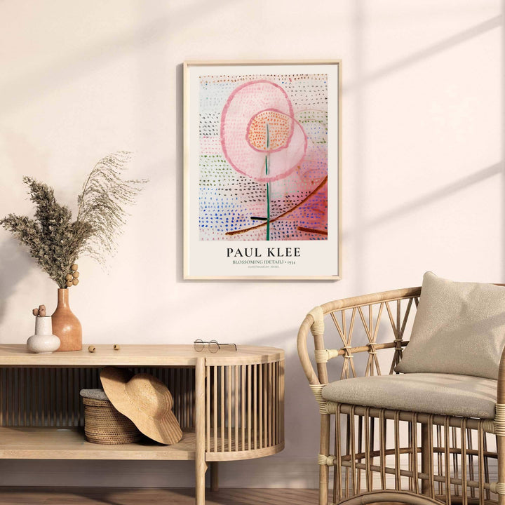 Anchored by a soft pink floral form rising gracefully through the composition, this Kunstmuseum Basel-archived Paul Klee Blossoming Detail (Blühend) 1934 wall decor captures the delicate balance between natural rhythm and abstract design. Offered by MapYourDreams, this artwork is available in flexible options including unframed paper, custom wooden frames, and gallery canvas wraps.