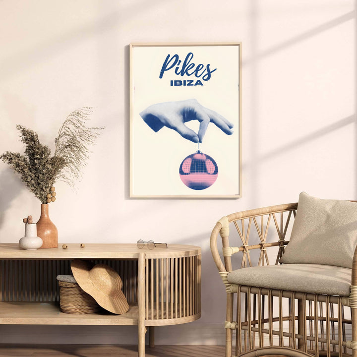 Minimalist Balearic party poster featuring Pikes Hotel Ibiza text and surreal disco ball pop art, available from MapYourDreams as an unframed art print, canvas wall decor, or custom framed print for living room walls and music collection display areas.