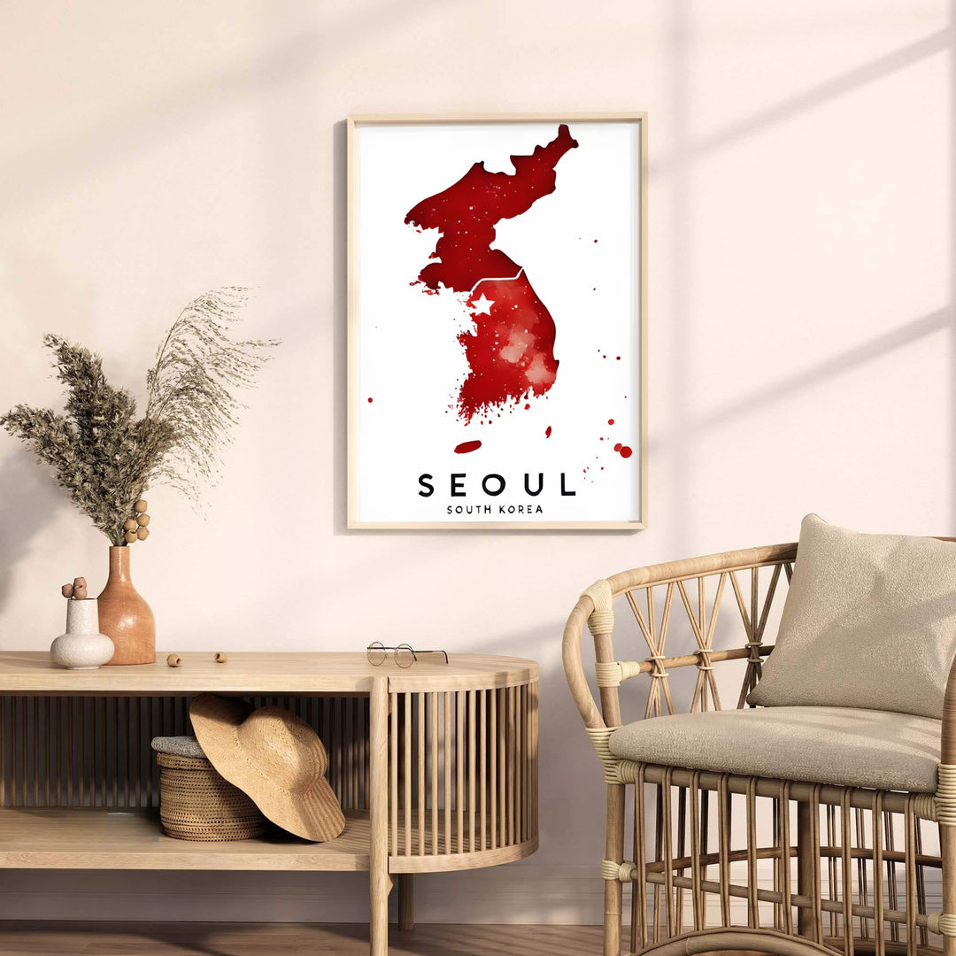 Eye-catching red watercolor geographic photo print illustrating the full peninsula and capital city of Seoul, South Korea, offered by MapYourDreams in versatile styling formats like unframed paper, custom picture frames, and canvas that add refined artistic charm to your home.