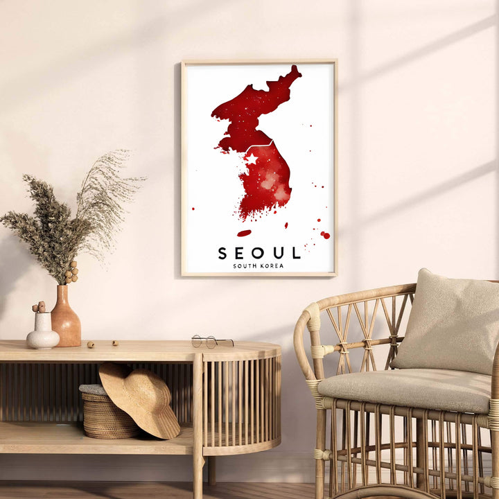 Eye-catching red watercolor geographic photo print illustrating the full peninsula and capital city of Seoul, South Korea, offered by MapYourDreams in versatile styling formats like unframed paper, custom picture frames, and canvas that add refined artistic charm to your home.