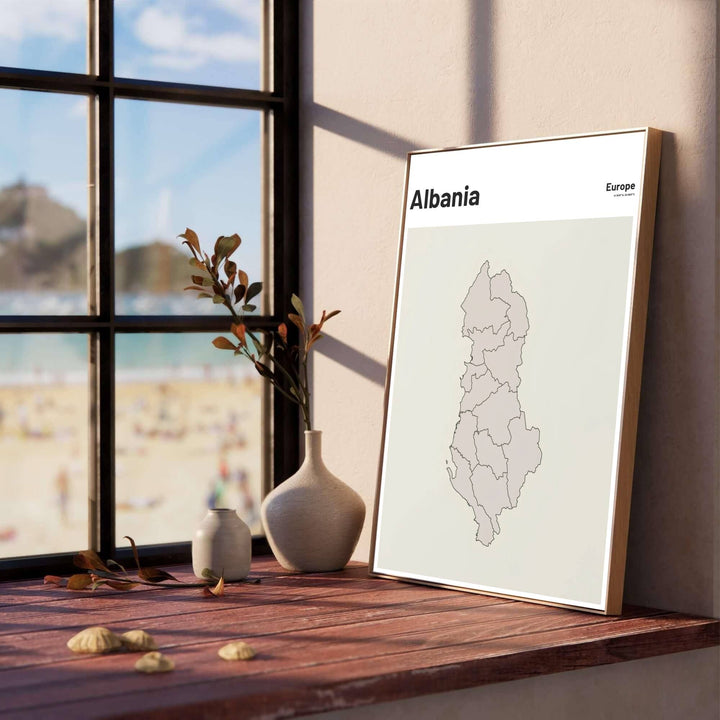 Capturing Albania’s Balkan border outline in clean dark grey vectors against a warm beige tone, this fine art poster brings understated charm to offices. Offered by MapYourDreams, this artwork is available in flexible options including unframed paper, custom wooden frames, and gallery canvas wraps.