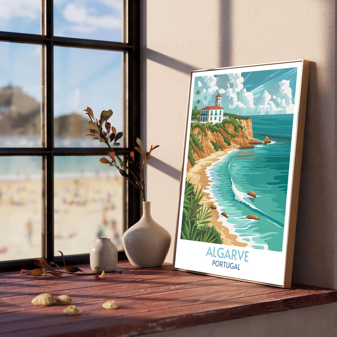 Lush green palm leaves frame a view of a coastal headland and white lighthouse tower in this Algarve wall decor piece, available as a stretched canvas or in a gold metal frame for elegant rooms.