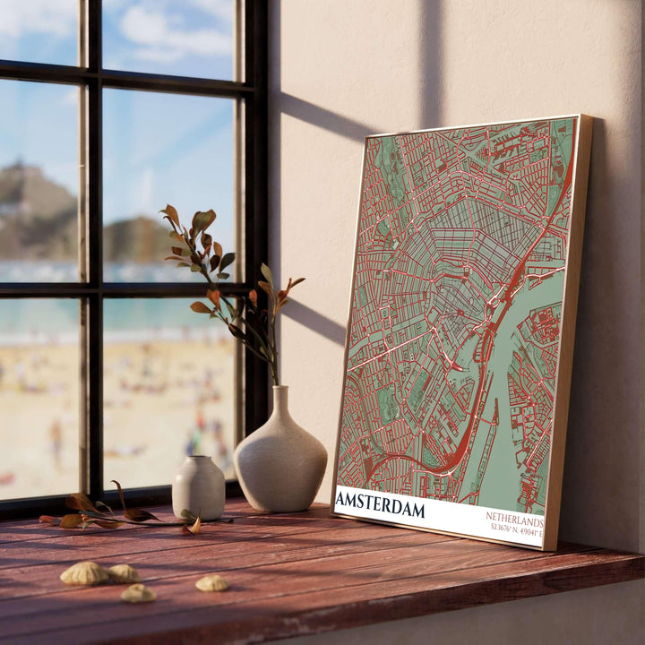 Architectural street grid poster depicting the layout of Amsterdam Netherlands in a sage green and red colorway, provided by MapYourDreams in flexible choices including unframed fine art paper, stretched canvas, or custom frames in black, white, wood, gold, and silver.