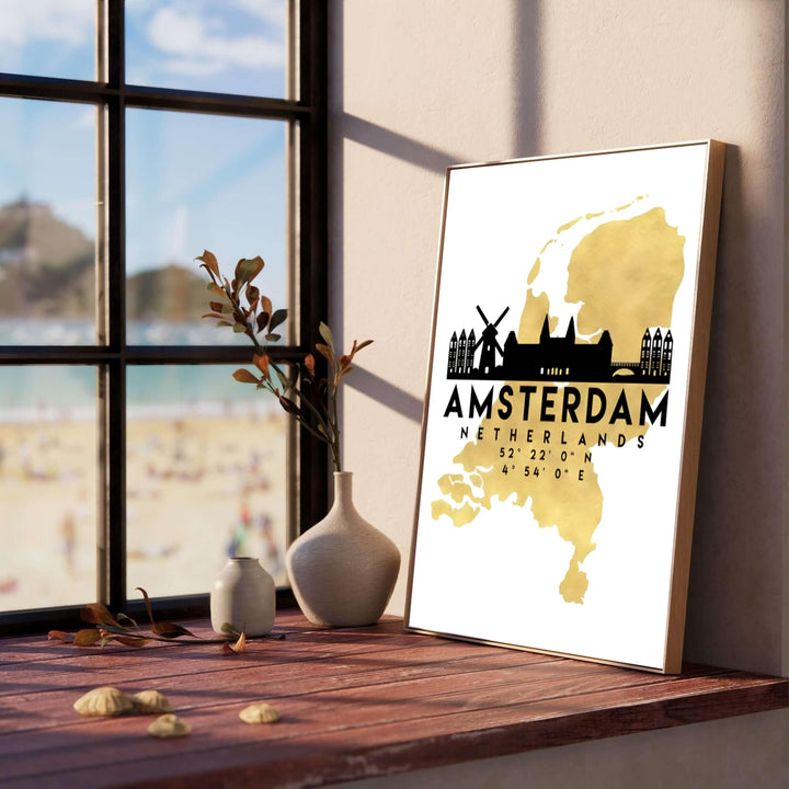 Graphic city skyline poster depicting a gold map silhouette of the Netherlands with black canal house and windmill icons, provided by MapYourDreams in flexible choices including unframed fine art paper, stretched canvas, or custom frames in black, white, wood, pure gold, and silver.