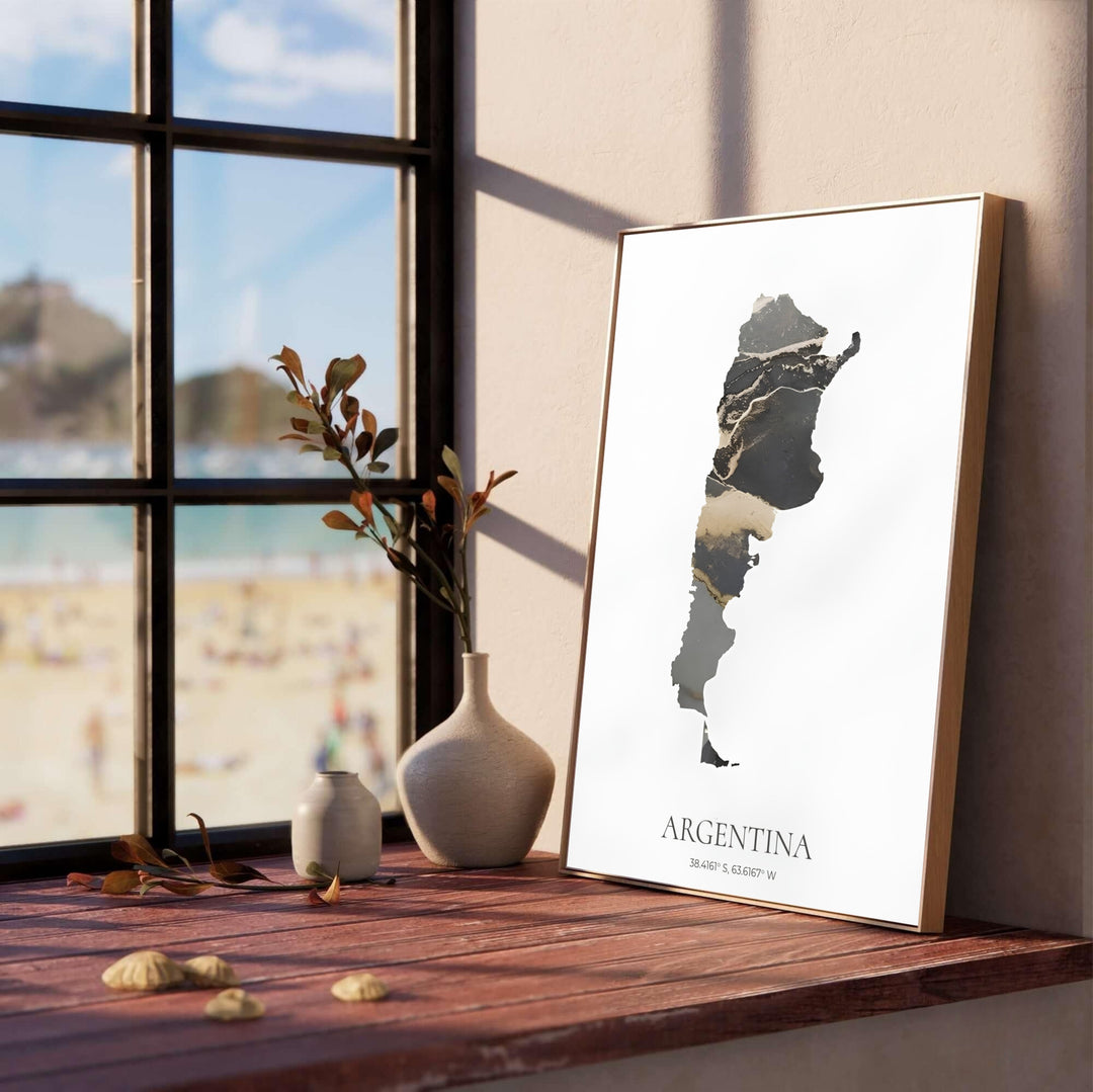 Minimalist Argentina map artwork with gold accents and latitude coordinates displayed for South American decor themes. Offered by MapYourDreams, this artwork is available in flexible options including unframed paper, custom wooden frames, and gallery canvas wraps for modern office walls.