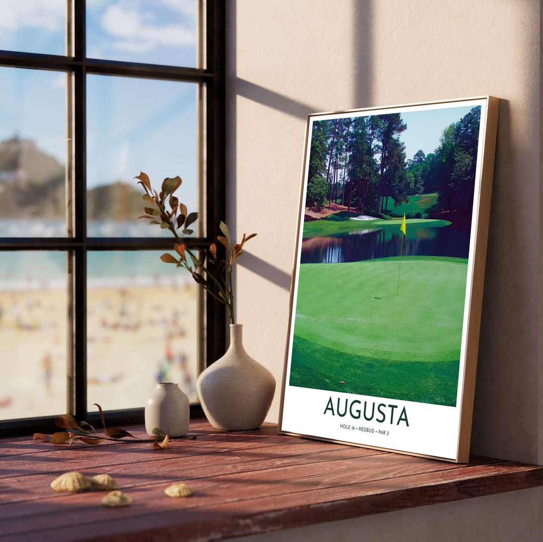 Realist landscape golf print of Augusta Georgia displaying sunlight filtering onto the manicured grass of Hole 16 Redbud and the dark reflective pond. Offered by MapYourDreams, this artwork is available in flexible options including unframed paper, custom wooden frames, and gallery canvas wraps for tailored home wall decor setups.