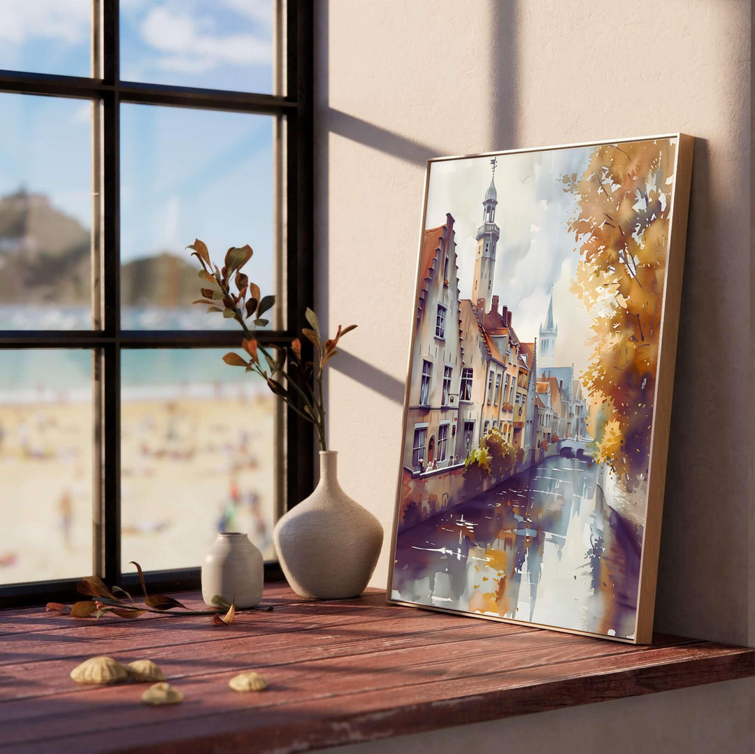 A atmospheric watercolor travel print depicting water reflections and medieval step-gabled buildings in Bruges, Belgium, during the autumn season. Customers can choose from several presentation options including unframed fine art paper, custom wood and metal frames, and gallery wrapped canvas wall decor.