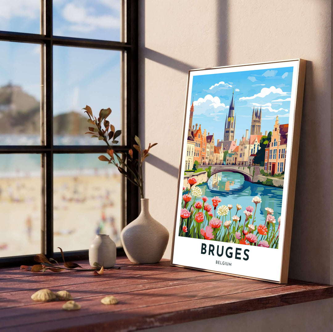Detailed travel wall art depicting colorful pink wildflowers on a riverbank in Bruges, Belgium, with a historic stone bridge under a bright sky. Offered by MapYourDreams, this artwork is available in flexible options including unframed paper, custom wooden frames, and gallery canvas wraps.