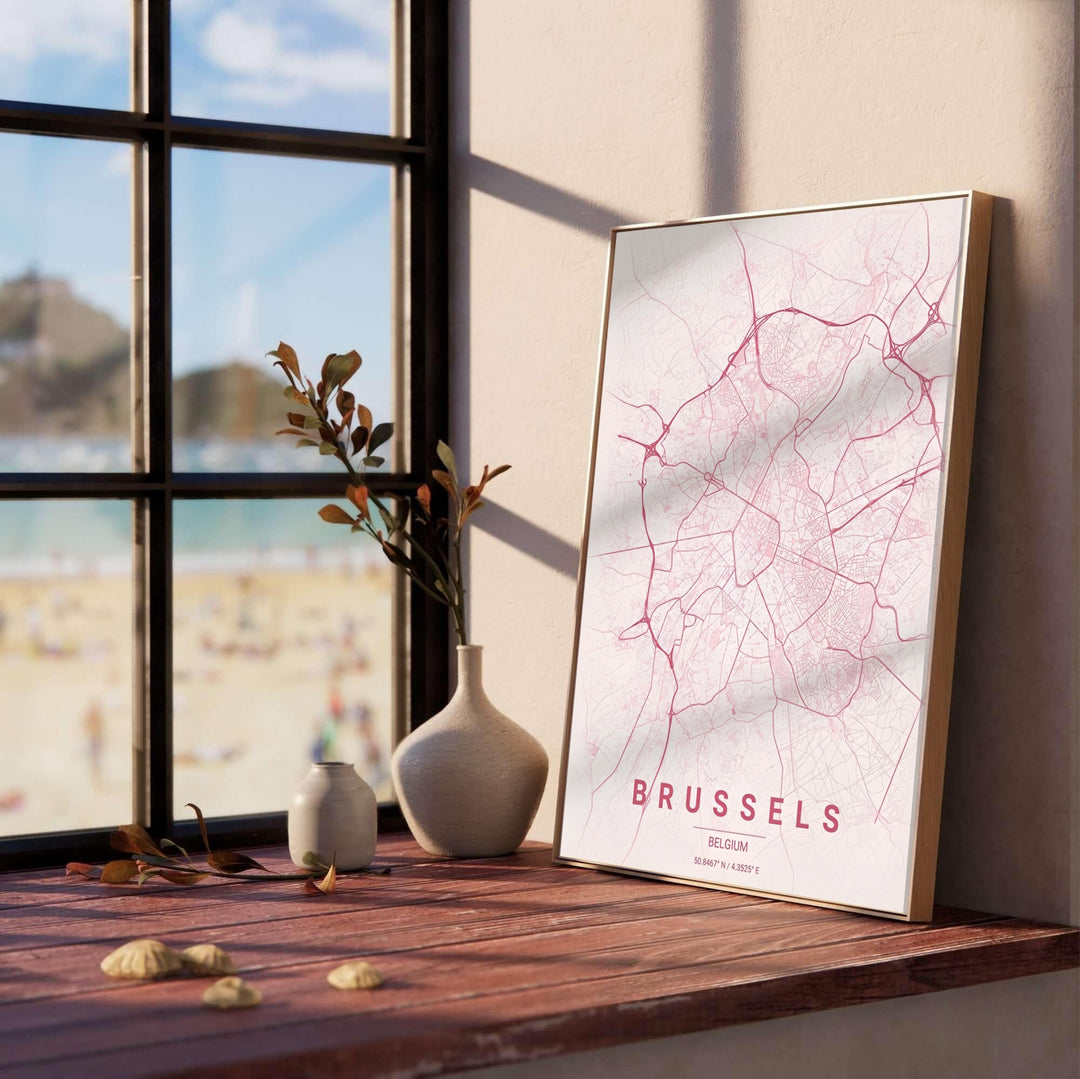 Sleek geographic poster capturing the detailed street grid and latitude-longitude coordinates of Brussels, Belgium, with clean rose bottom typography. Offered by MapYourDreams, this artwork is available in flexible options including unframed paper, custom wooden frames, and gallery canvas wraps.