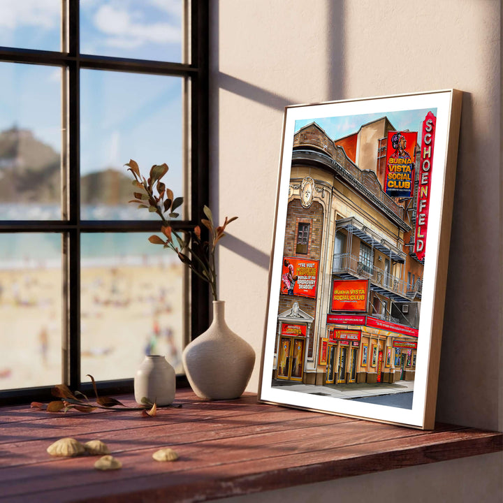 Detailed urban streetscape poster of the Gerald Schoenfeld Theatre on Broadway capturing warm sunlit brick walls and glowing entry lights, presented by MapYourDreams where options include a high-quality unframed poster, a stretched gallery canvas, or a custom framed art piece for offices.