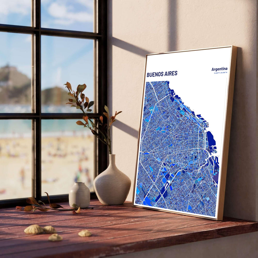 Abstract city map poster of Buenos Aires with latitude and longitude coordinates displayed beneath the blue mosaic street grid. Produced by MapYourDreams, you can order this design on fine art paper, mounted in protective frames, or as a canvas display.
