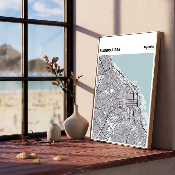 Ice blue and charcoal street map wall art of Buenos Aires detailing urban avenues, coastal shorelines, and city blocks. Produced by MapYourDreams, you can order this design on fine art paper, mounted in protective frames, or as a canvas display.
