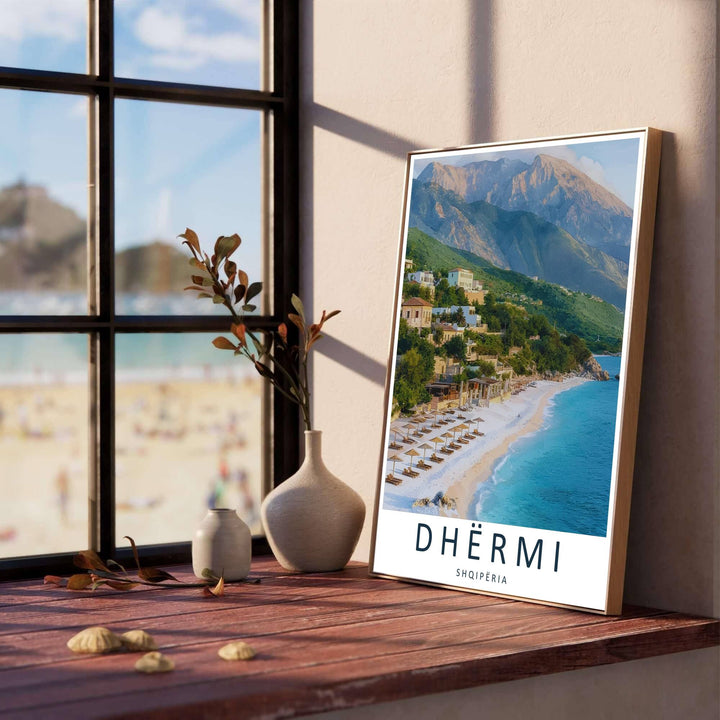 Dramatic coastal mountains rise directly above the clear blue waters and sun loungers of Dhërmi Beach, creating an impressive scenery poster for any living room. Offered in versatile formats, including unframed art paper, custom wood framing, and stretched canvas wraps.