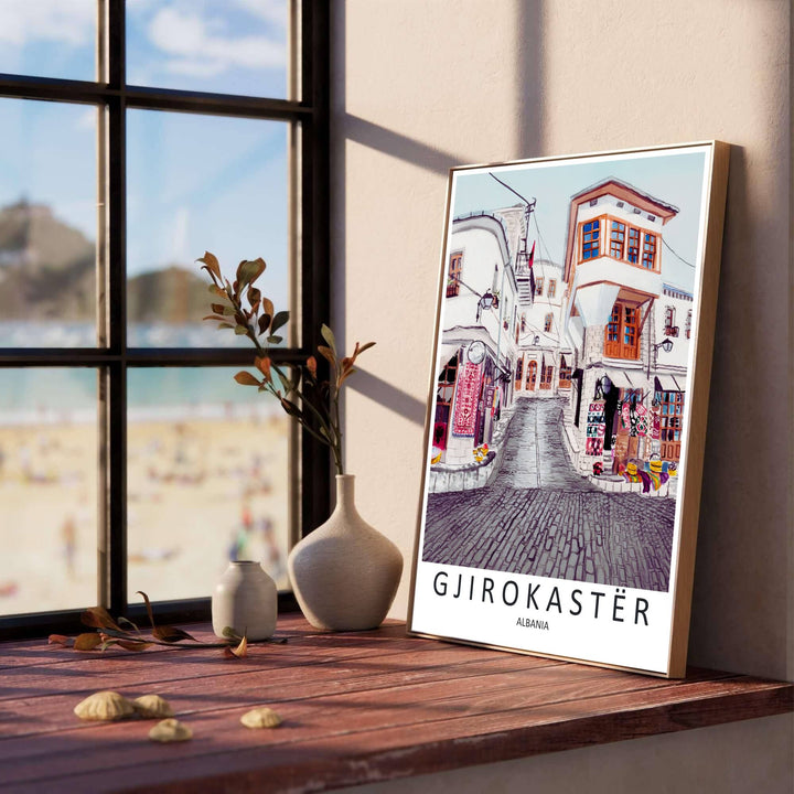 Overhanging wooden balconies and slate roofs line the steep street in Gjirokastër, creating a classic European travel poster for living rooms. Offered in versatile formats including unframed art paper, custom wood framing, and stretched canvas wraps to elevate your space.