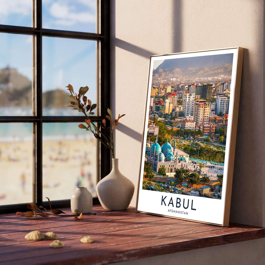 Panoramic cityscape print of Kabul Afghanistan capturing sunny urban buildings and distant mountain ranges, offered by MapYourDreams with selection options for an unframed paper print, ready to hang canvas wall art, or custom framed poster in grey, bronze, and gold frame finishes.