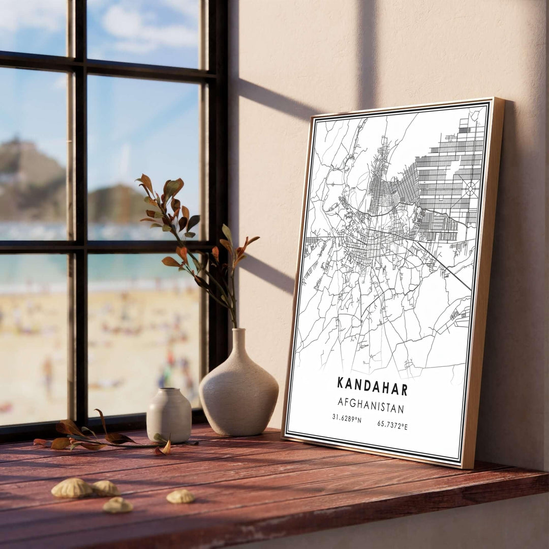 Contemporary urban road map artwork of Kandahar, Afghanistan, capturing detailed city grids, arterial avenues, and minimal typography. Offered by MapYourDreams as an unframed fine art print, a stretched gallery canvas, or a framed wall poster with a retro black or natural frame finish for studio displays.