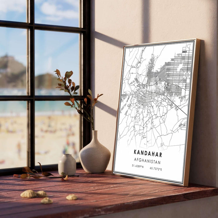 Contemporary urban road map artwork of Kandahar, Afghanistan, capturing detailed city grids, arterial avenues, and minimal typography. Offered by MapYourDreams as an unframed fine art print, a stretched gallery canvas, or a framed wall poster with a retro black or natural frame finish for studio displays.
