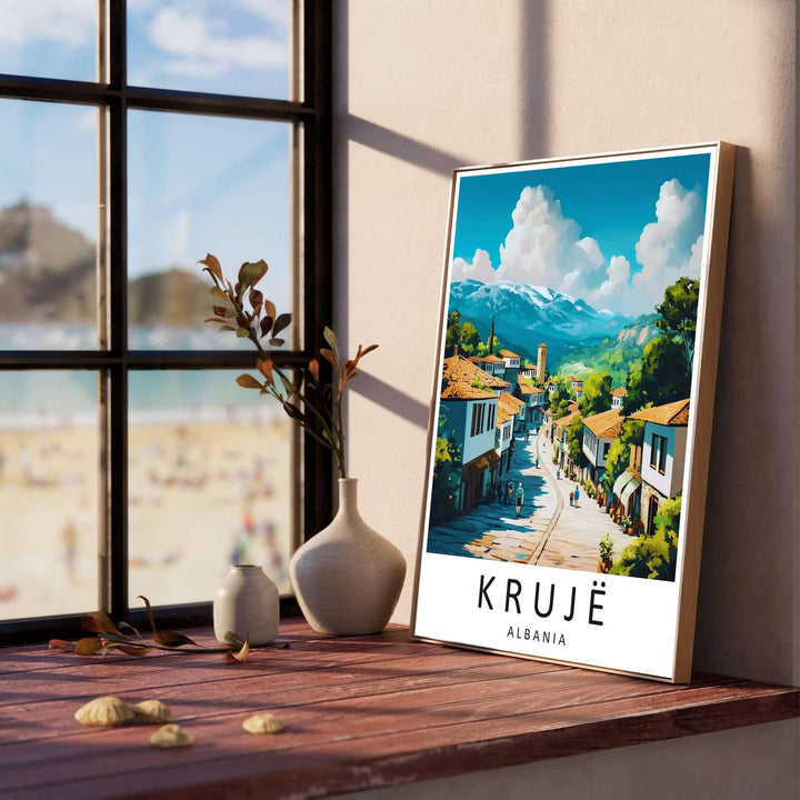 Whitewashed stone buildings with dark timber windows line the sloping pathway of Krujë, creating a classic European travel poster for living rooms. Offered in versatile formats including unframed art paper, custom wood framing, and stretched canvas wraps to elevate your space.
