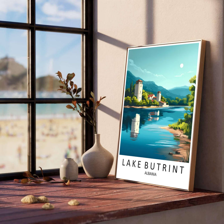 White stone fortress towers and terracotta-roofed outbuildings line the serene shores of Lake Butrint, creating a classic European retro poster. Offered in versatile formats including unframed art paper, custom wood framing, and stretched canvas wraps to elevate your space.