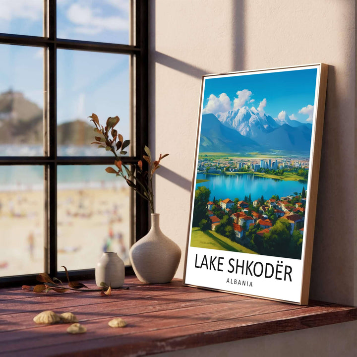 Vibrant terracotta roofs and green meadow slopes line the foreground of Lake Shkodër, creating a classic European retro poster for living rooms. Offered in versatile formats including unframed art paper, custom wood framing, and stretched canvas wraps to elevate your space.