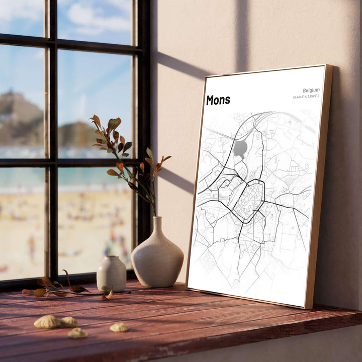 Minimalist black line vector map poster of Mons, Belgium, set against a pristine white background for modern interior wall decoration. Offered by MapYourDreams, this artwork is available in flexible options including unframed paper, custom wooden frames, and gallery canvas wraps.
