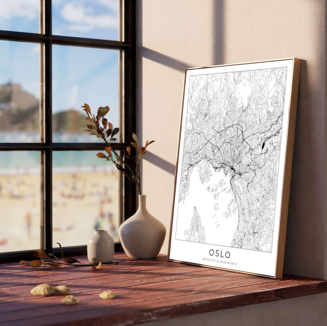 Modern cartographic vector print featuring the urban street grid of Oslo Norway in crisp black line art over a white background. Created by MapYourDreams, this map artwork is offered as an unframed fine art paper print, custom wooden framed setup, or floating canvas wall display.