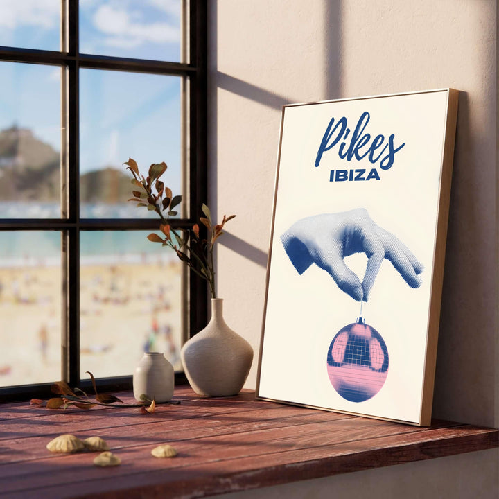 Balearic island nightclub art print featuring Pikes Ibiza lettering and surreal pop-art disco ball symbolism, supplied by MapYourDreams with selection options for an unframed poster, gallery stretched canvas, or custom framed print decor for modern home bar wall styling.