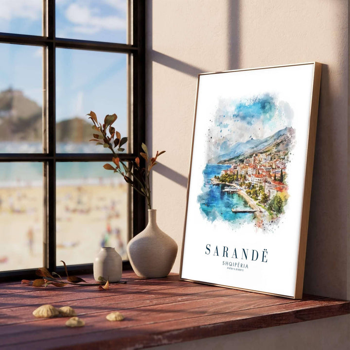 Soft blue and cerulean watercolor washes illustrate the serene bay of Sarandë, creating a classic European travel poster for living rooms or bedrooms. Offered in versatile formats including unframed art paper, custom wood framing, and stretched canvas wraps to elevate your space.