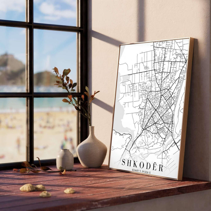 Featuring the native spelling SHKODËR alongside geographic coordinates, this black and white road map print celebrates northwestern Albania&