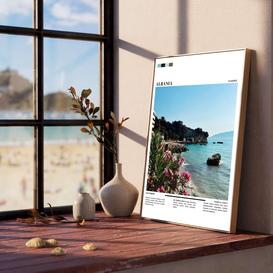 Vibrant floral blooms and crystal-clear turquoise waves line the foreground of the Vlorë riviera, creating a classic European coastal poster for modern living rooms. Offered in versatile formats including unframed art paper, custom wood framing, and stretched canvas wraps to elevate your space.