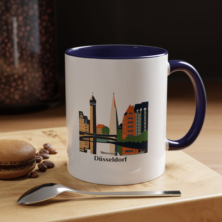 A beautifully designed Düsseldorf mug showcasing the city's landmarks and culture. Perfect for coffee or tea lovers, it features vibrant artwork inspired by Düsseldorf’s scenic beauty and historic landmarks. Dishwasher-safe and ideal for gifting or keepsakes.