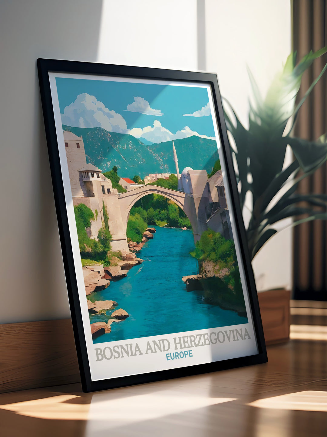 Stari Most travel print beautifully showcases the iconic Old Bridge of Mostar, Bosnia and Herzegovina. This canvas art offers a vivid representation of the historic structure and the lush environment that surrounds it, perfect for adding a touch of European history to your decor.